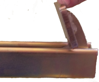 along the length of the clamp. A spring is used to lock it in place